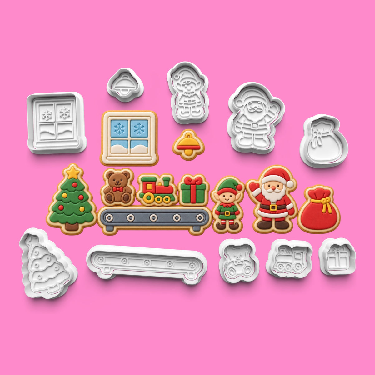 North Pole Workshop Christmas cookie cutter and embosser set of 10 designs including Santa, elf, Christmas tree, teddy bear, train, presents and festive decorations.