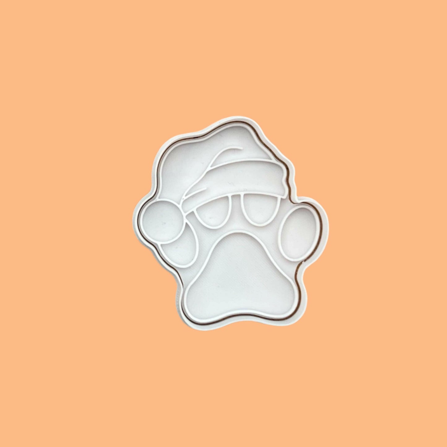 Paw Print with Santa Hat Embosser and Cookie Cutter Set – Festive Pet Lover's Baking Tool.