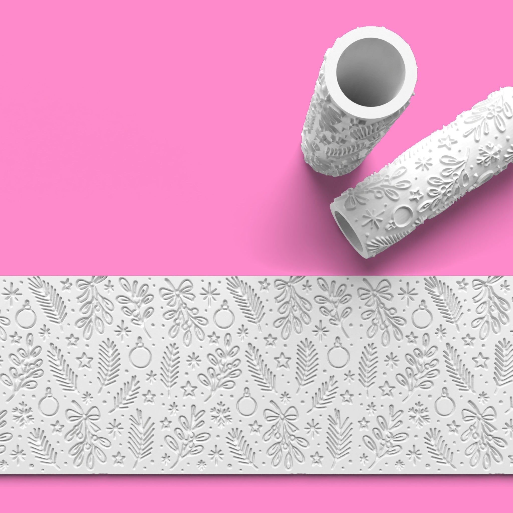 Decorative paper roll with embossed pattern on a pink background