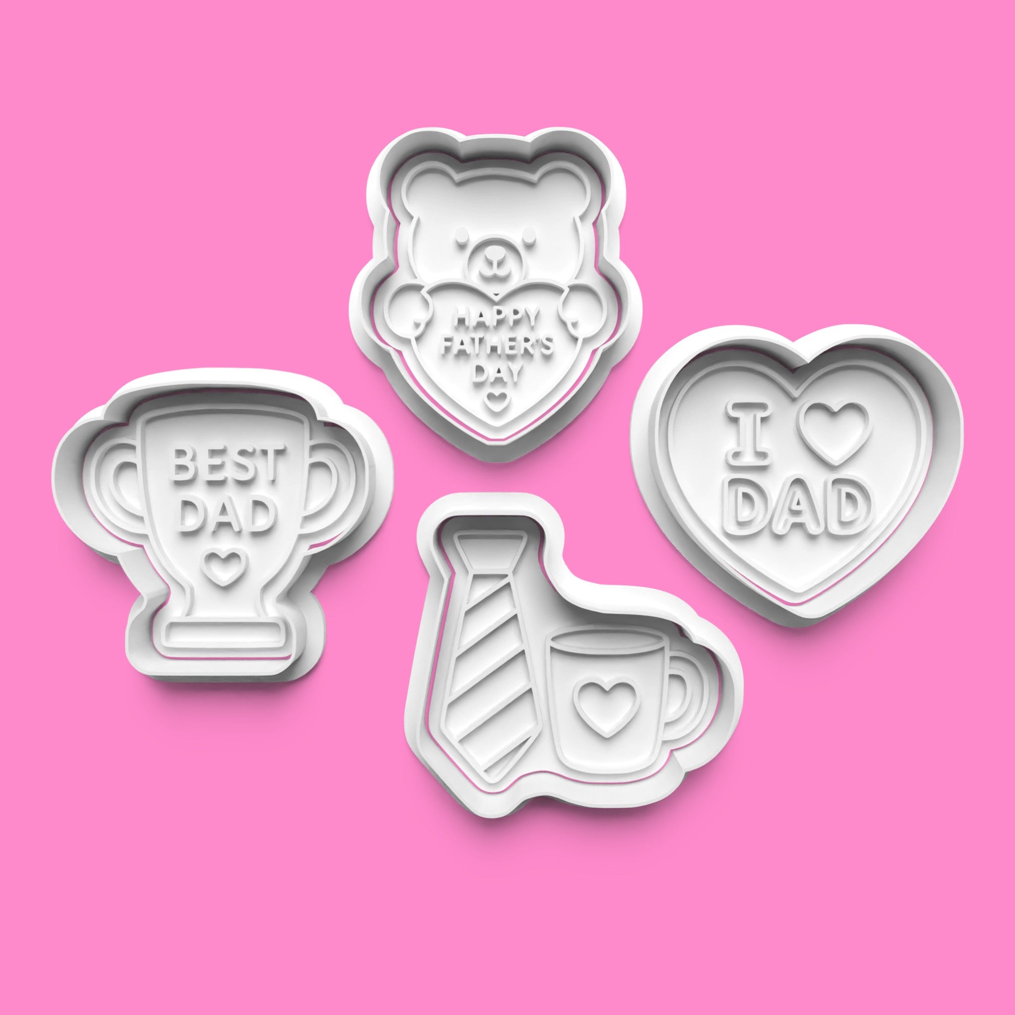 Set of four cookie cutters with Father's Day designs on a pink background