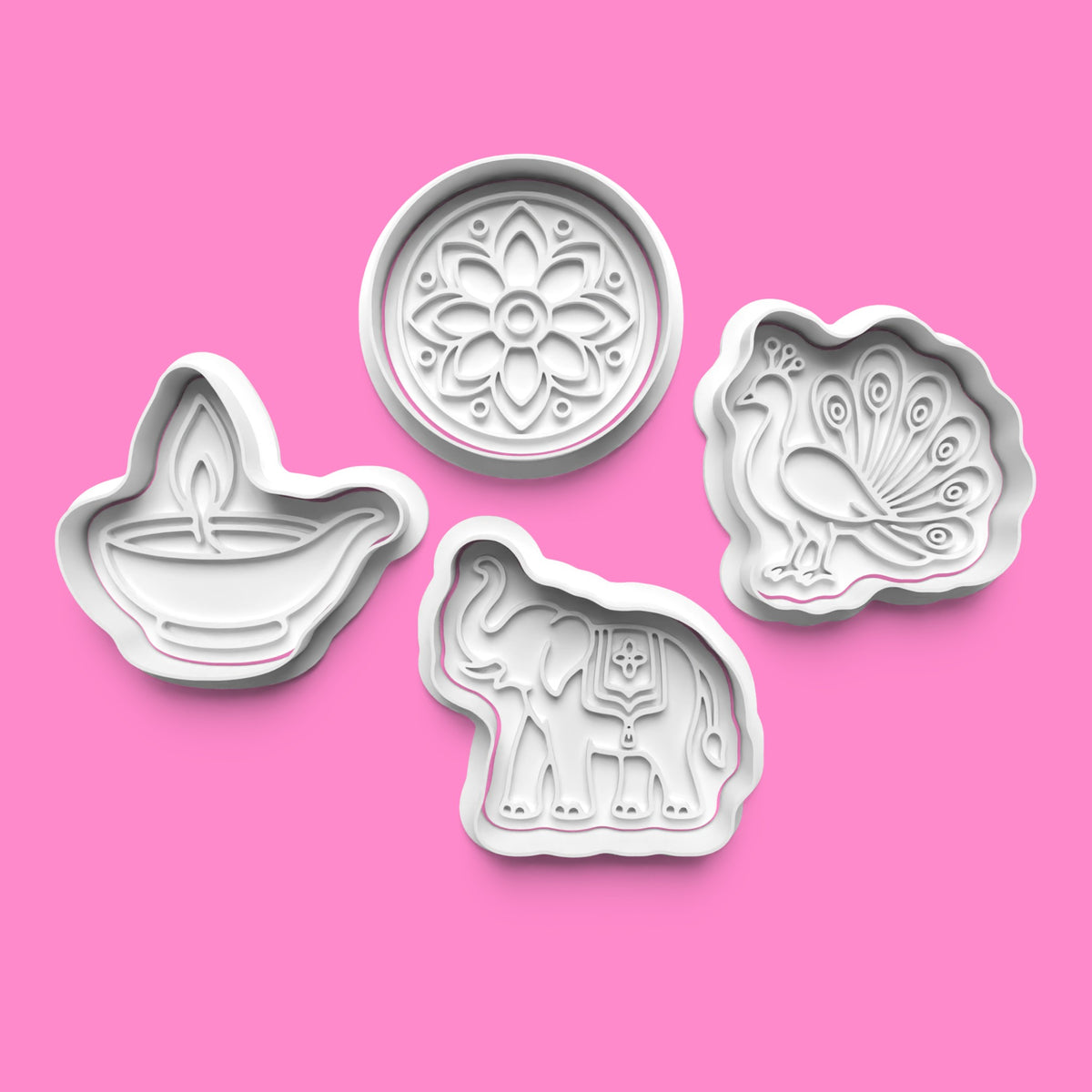 Four Diwali cookie cutters and embossers featuring a diya lamp, floral mandala, peacock and Indian elephant, available in 7cm, 8cm and 10cm.