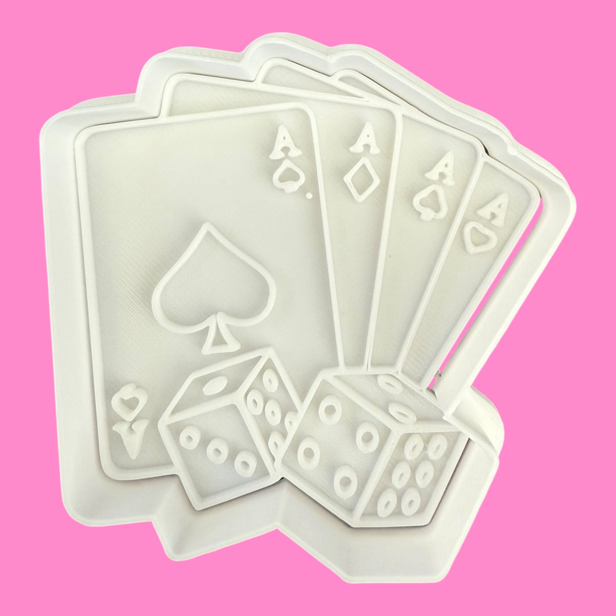 Four playing cards with dice on a pink background