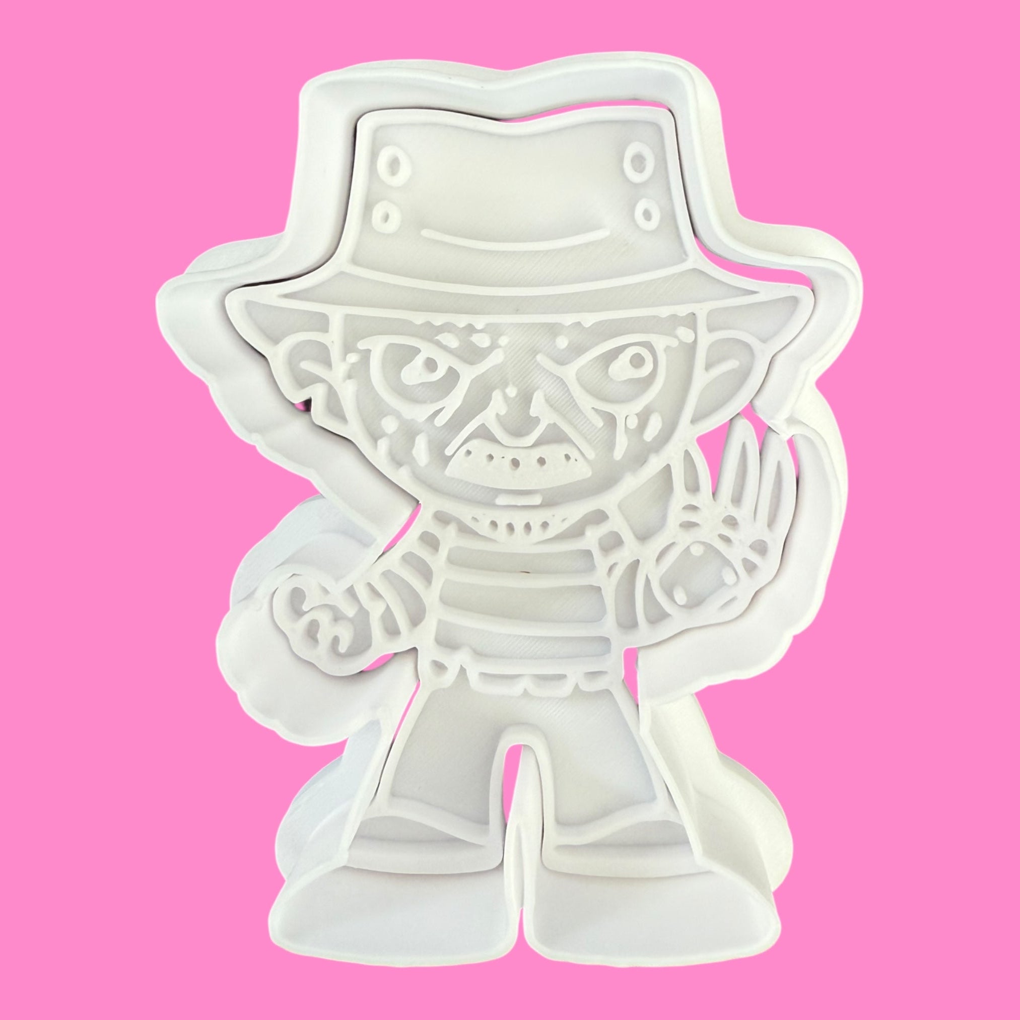 White plastic toy figure on a pink background