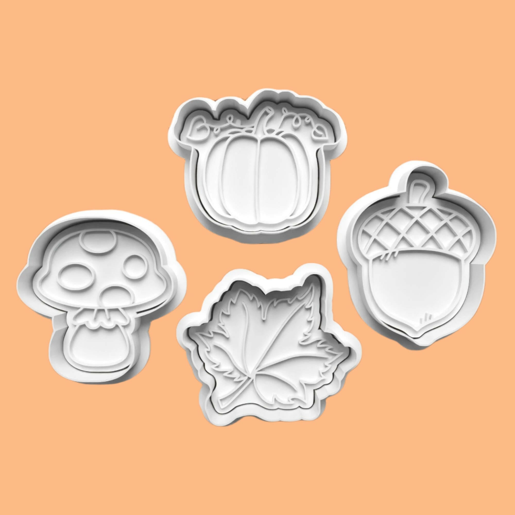 Autumn-Themed Embosser and Cookie Cutter Set – Acorn, Leaf, Toadstool, and Pumpkin Designs.