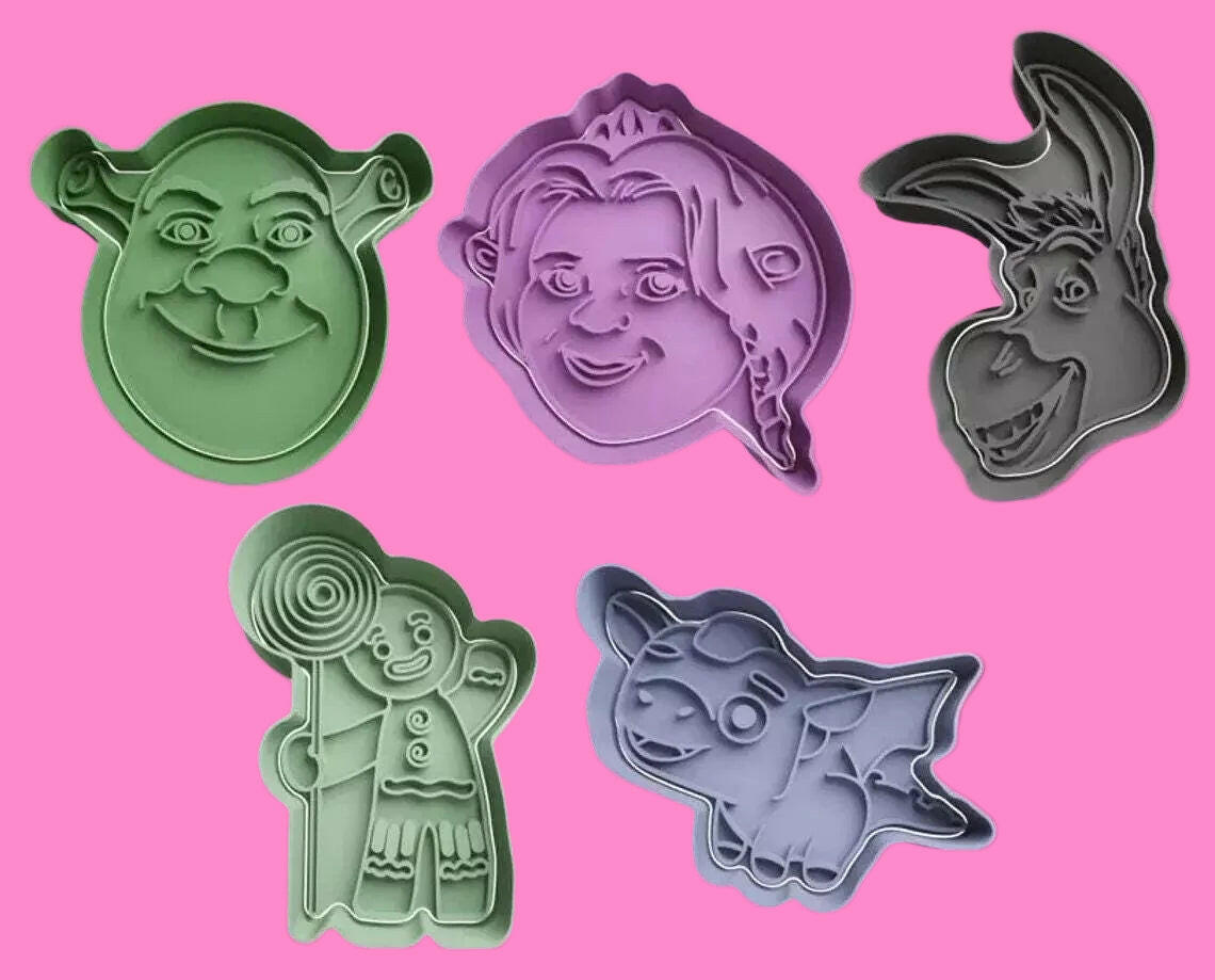 Bring the magic of Shrek to your baking with our cookie cutter set, featuring Shrek, Donkey, Fiona, and Gingy designs. Perfect for themed parties and movie nights. Hand wash only.".