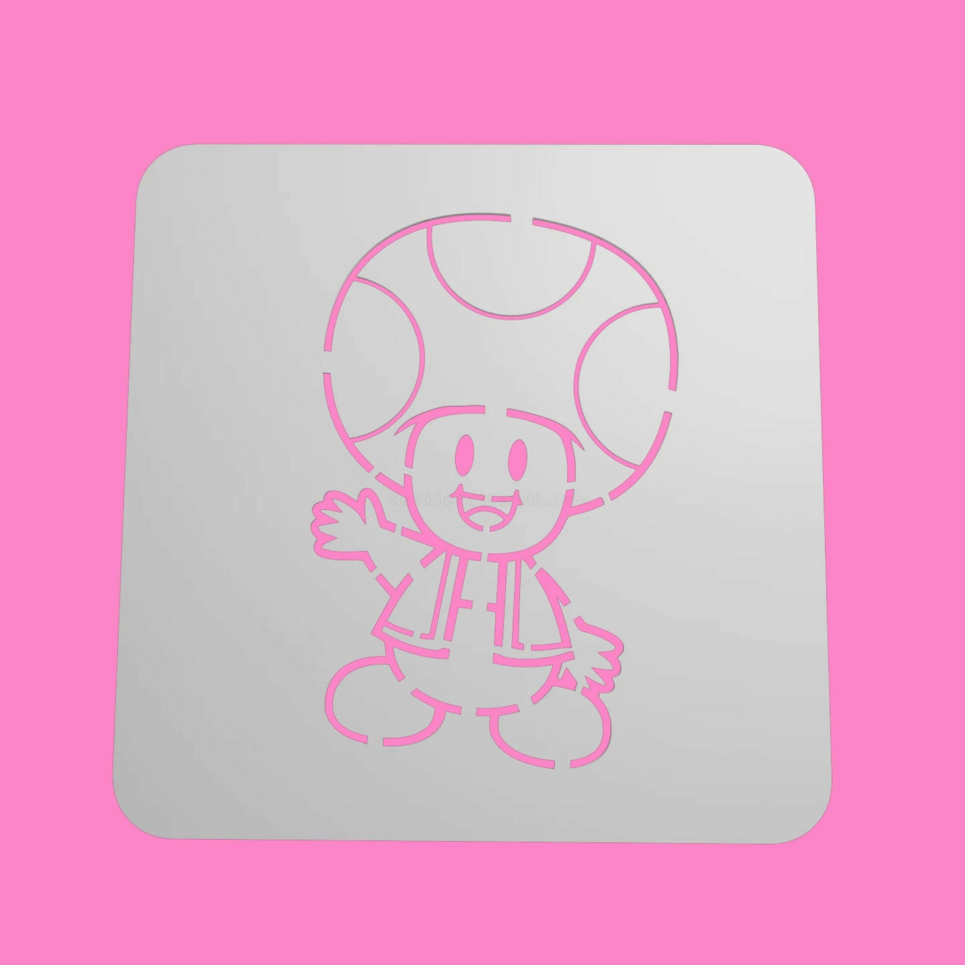 A white square food-safe PLA stencil with a character design of Toad from Super Mario, designed for decorating cookies, cakes, and fondant.